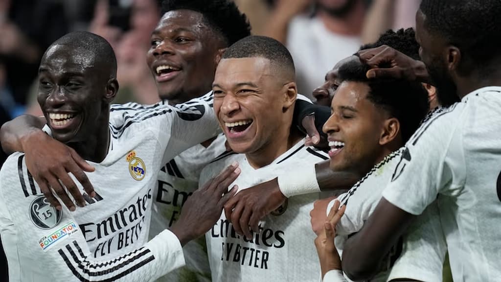 Kylian Mbappe and his Real Madrid teammates celebrate in an important Champions League match