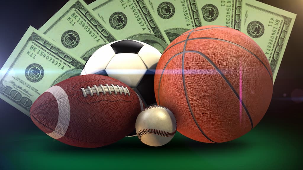 an image of a baseball, a football, a basketball, and a soccer ball with money in the background - Sports Betting Markets Guide cover
