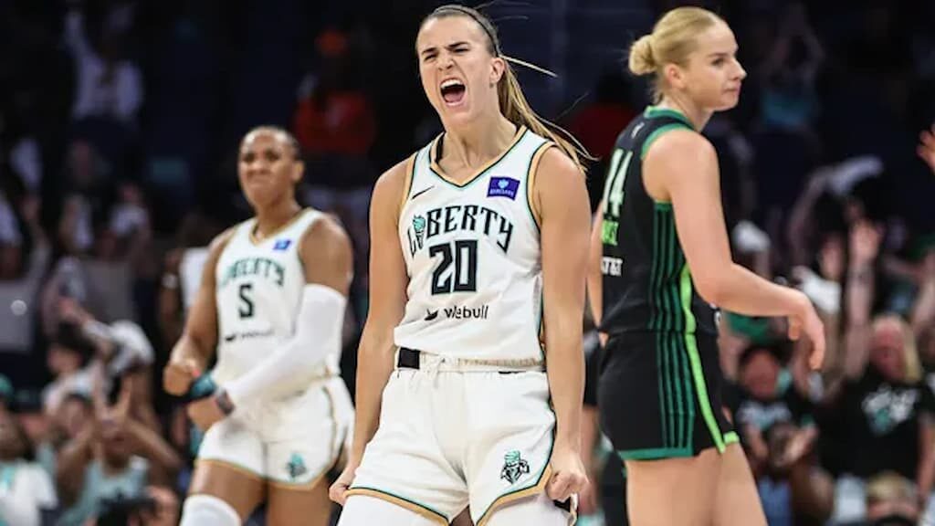 Sabrina Ionescu (#20, center) of the New York Liberty celebrates during a game