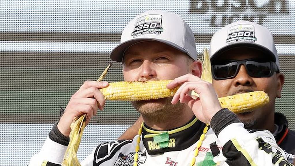 NASCAR Cup Series driver William Byron celebrates his 2025 Iowa Corn 350 win by sinking his teeth into an ear of corn