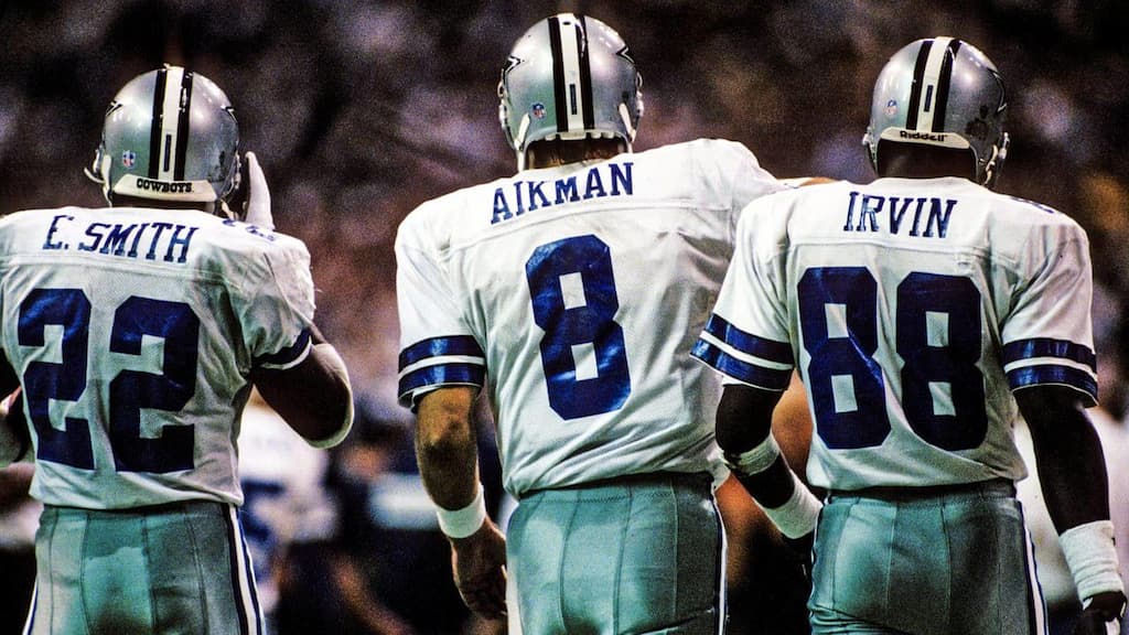 Dallas Cowboys legends Emmitt Smith (left), Troy Aikman (center), and Michael Irvin (right)